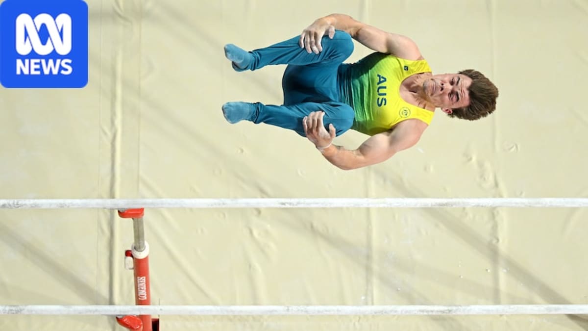 Australian gymnast Jesse Moore performs on parallel bars during Commonwealth Games men's team final