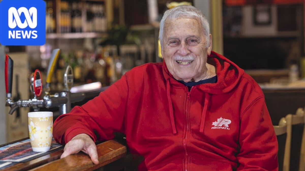 ** Jim Pohl, 86, stands smiling behind the bar at Perenjori Hotel in rural Western Australia