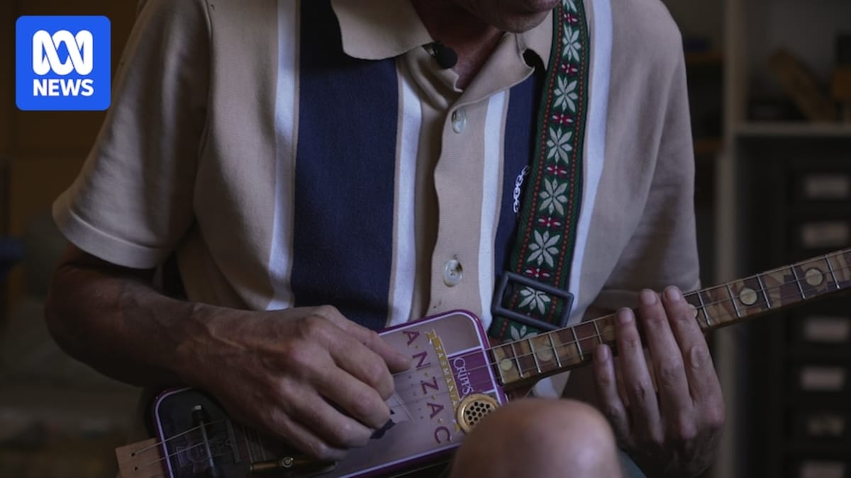 Tasmanian Musician Crafts Guitars from Biscuit Tins for Vets