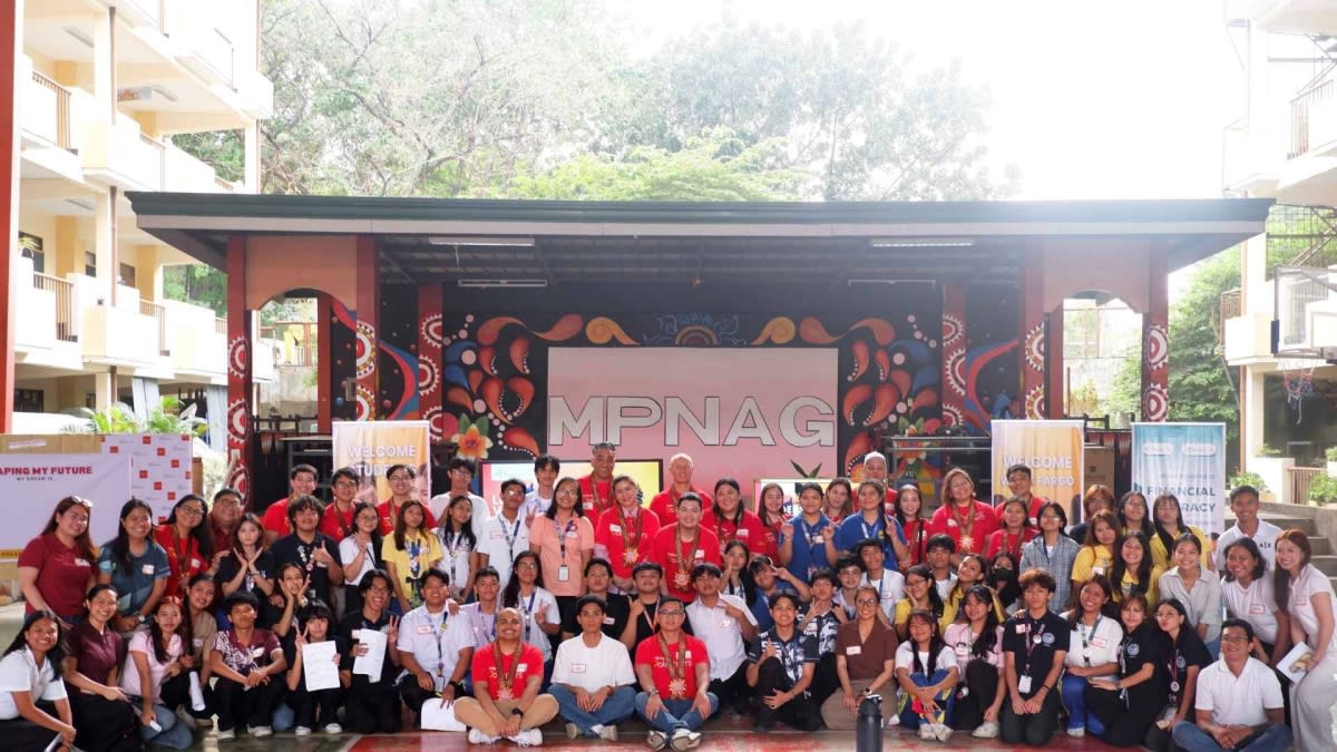 Filipino students and teachers participating in interactive financial literacy classroom session in Philippines