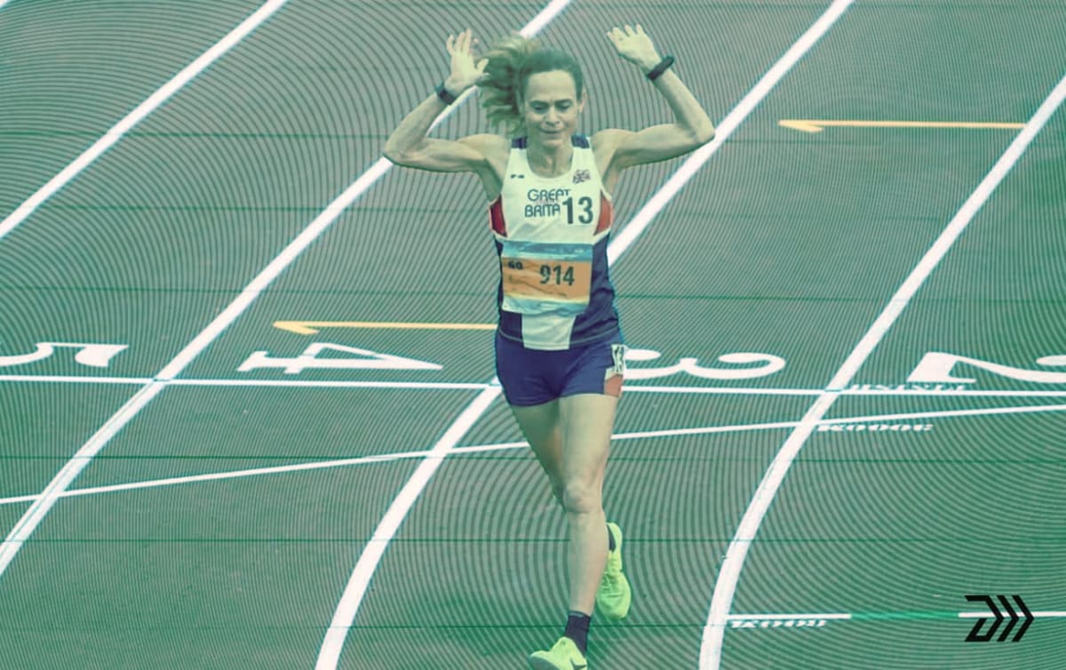Clare Elms crossing finish line at outdoor track competition in London