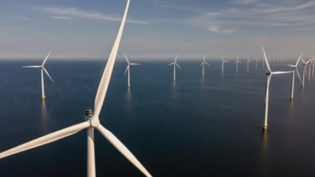 Offshore wind turbines in ocean waters near Nova Scotia coastline generating renewable energy