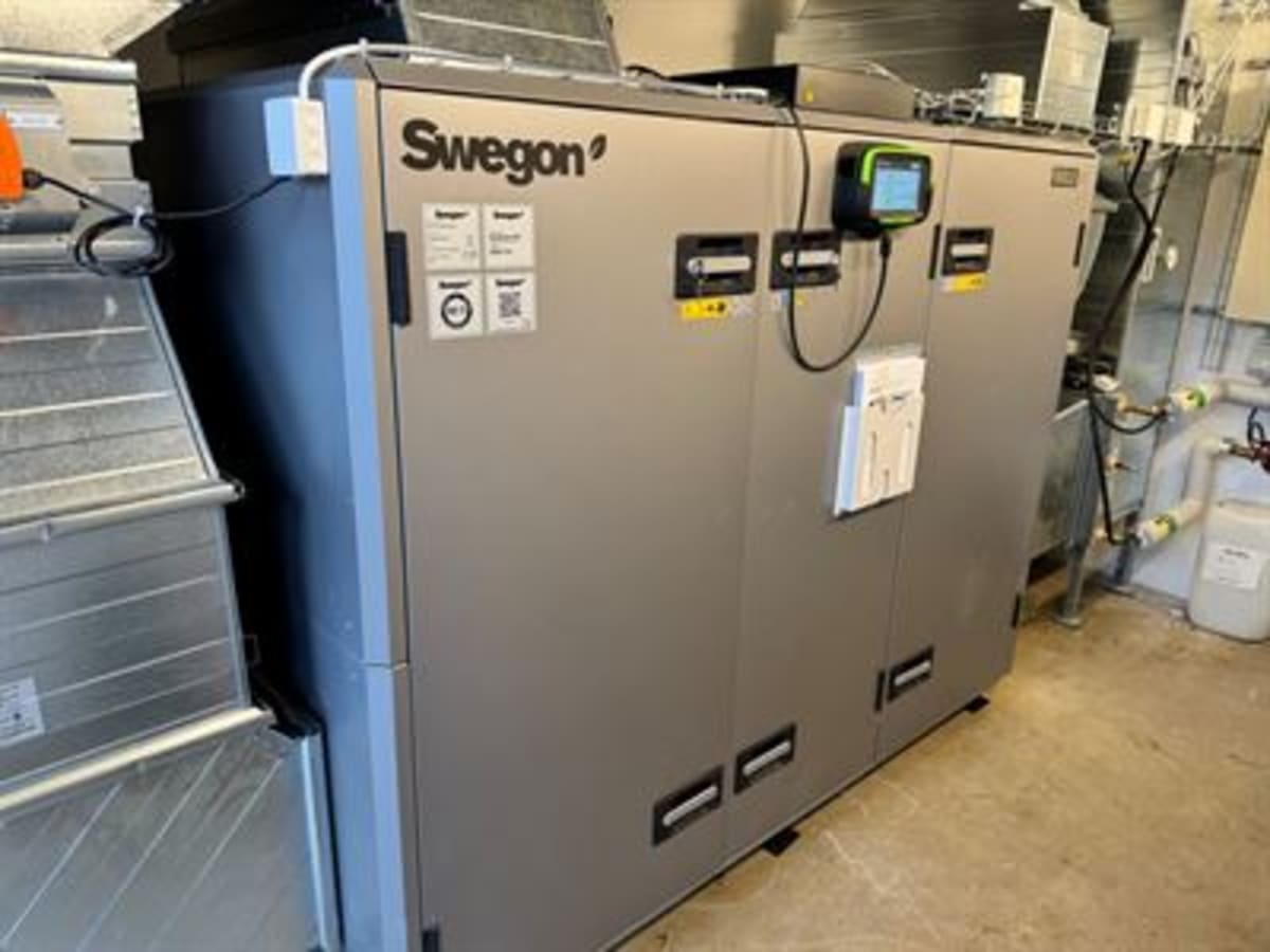 Industrial air handling unit being refurbished in Swedish factory for circular building renovation project