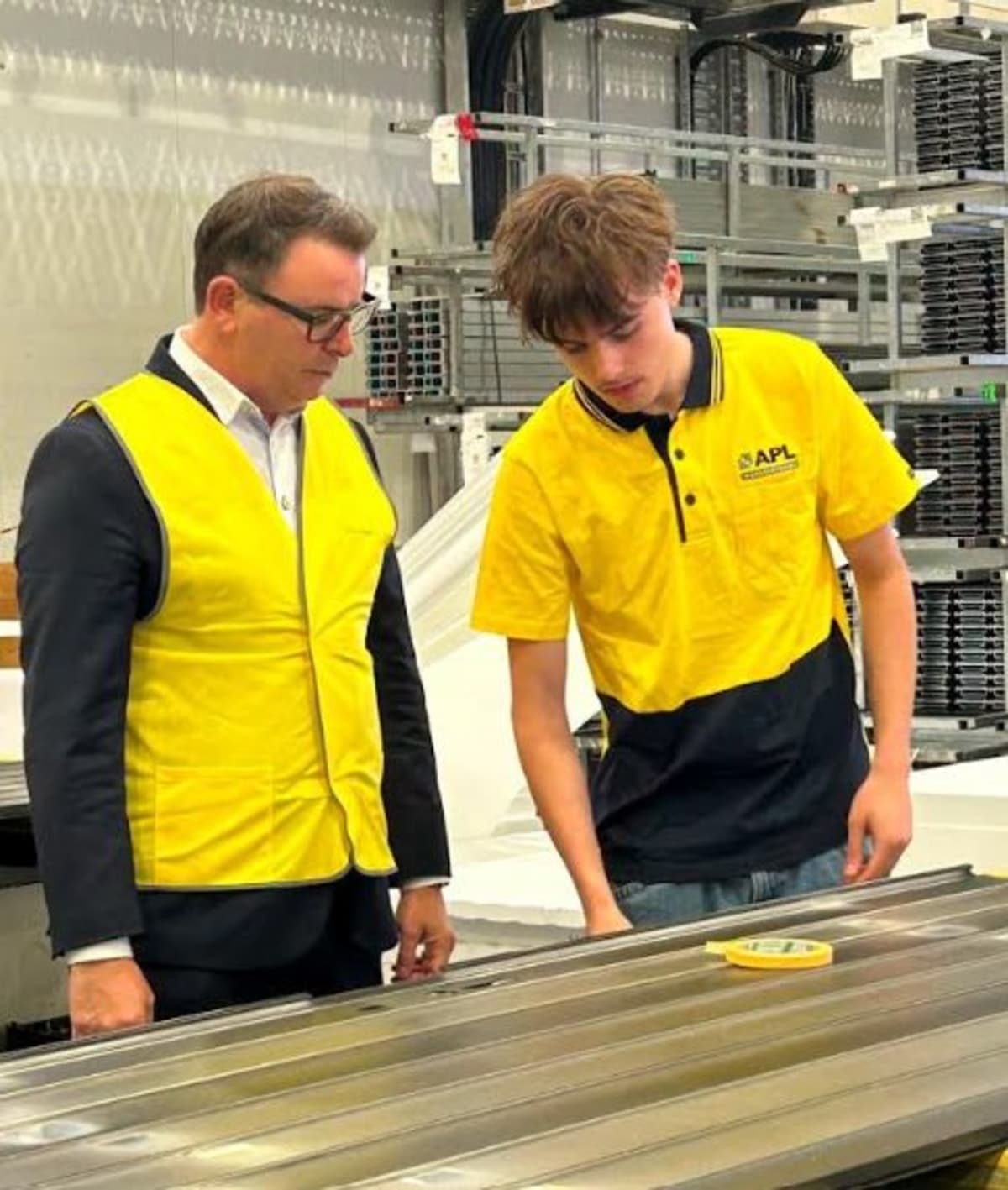 ** Minister Cameron Brewer with Quinn, Earn as You Learn graduate, at APL Manufacturing facility in Cambridge