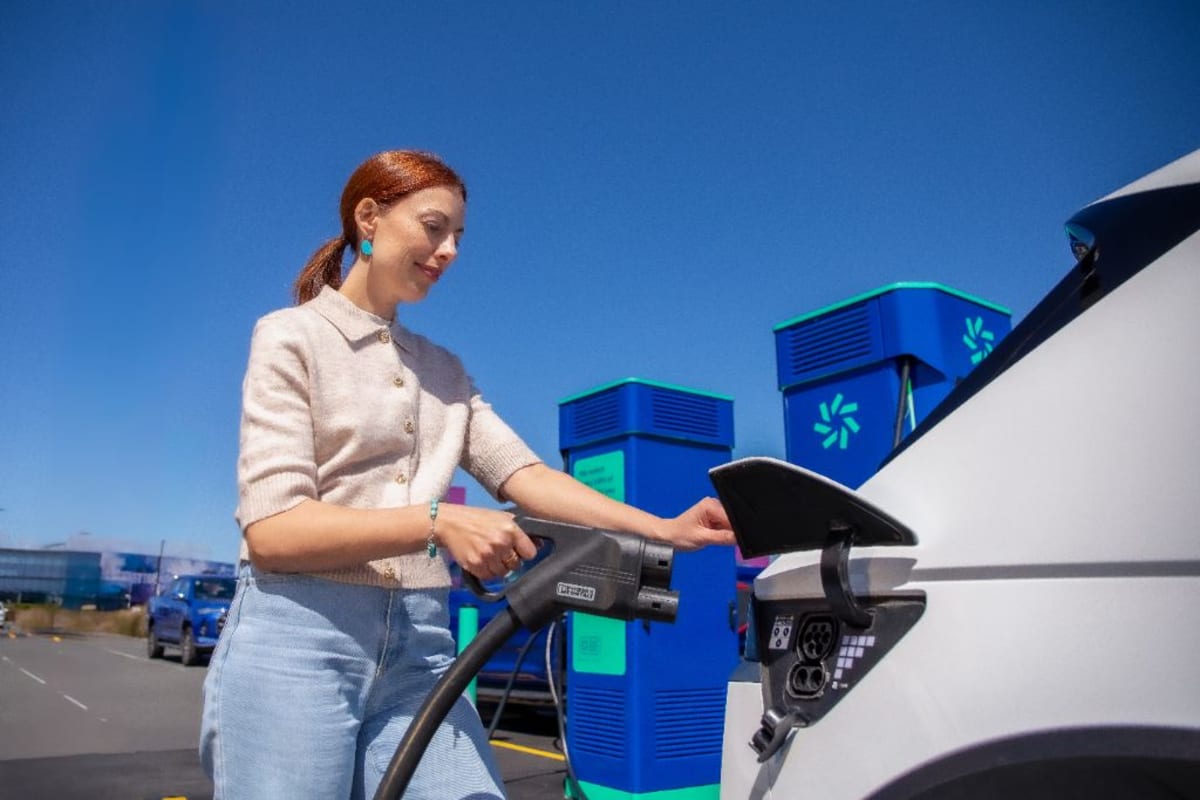 Electric vehicle charging at public charging station in New Zealand countryside location