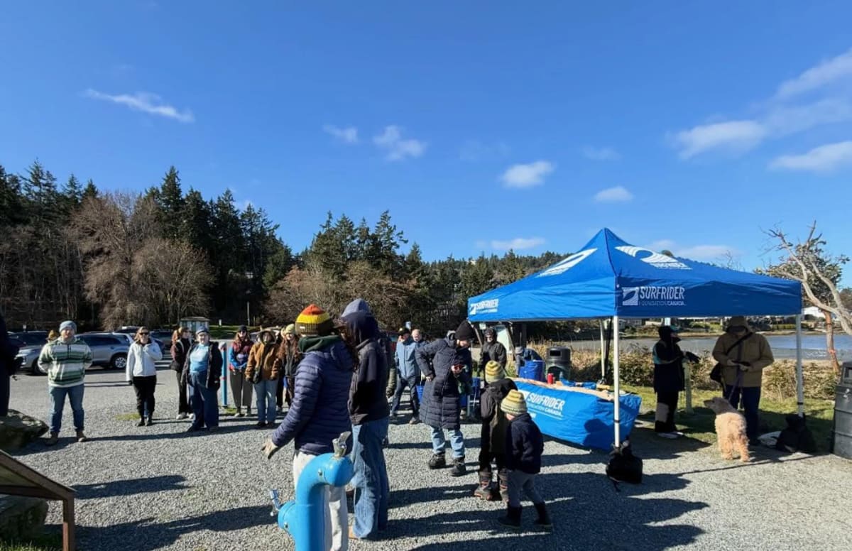 Volunteers gathering at Pipers Lagoon Park during March beach cleanup event organized by Surfrider Foundation