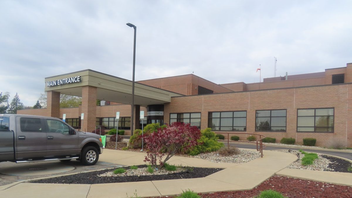 Cancer survivors and caregivers gathering together at community celebration event in Coldwater, Michigan