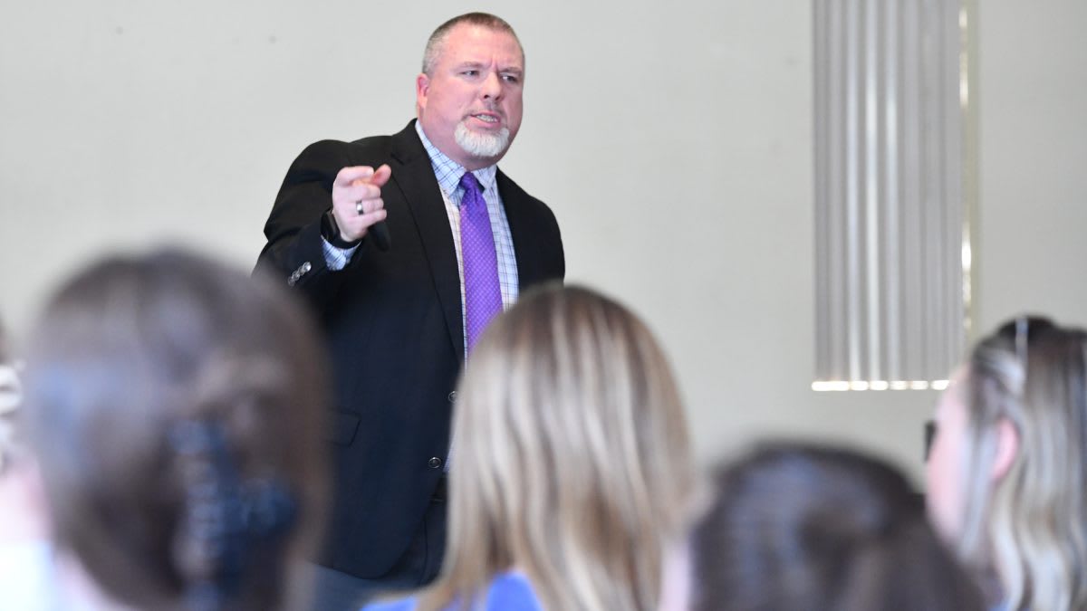 Scott Johnson speaking to education students at Lindsey Wilson University auditorium about teaching philosophy