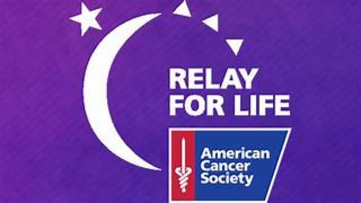 Cancer survivors gathering together at community celebration event with food and fellowship