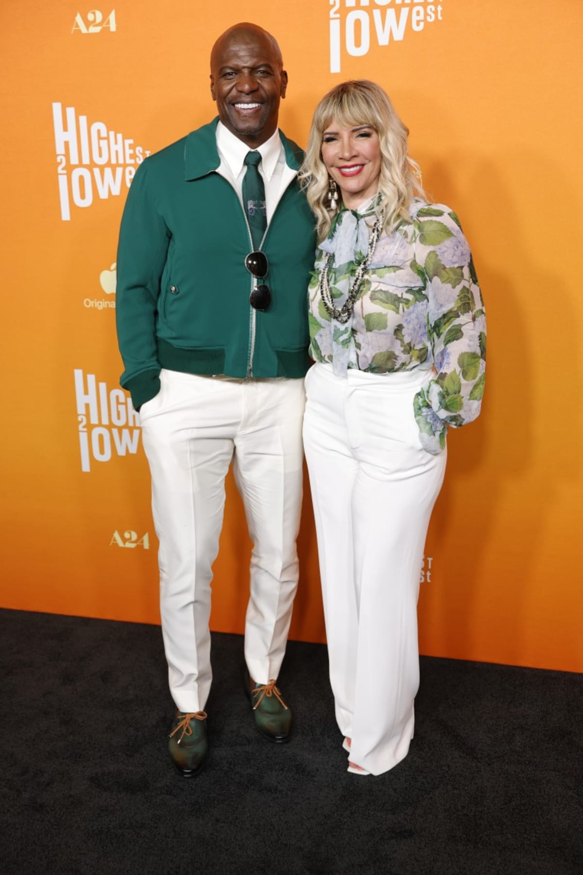 Rebecca King Crews smiling and holding a pen, demonstrating her restored ability to write