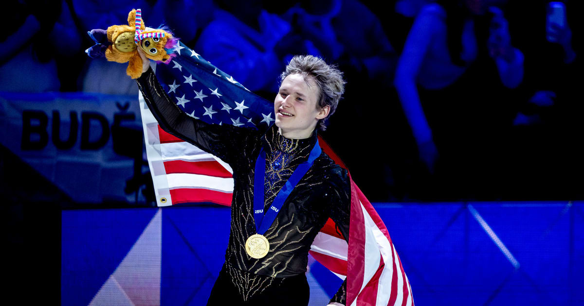 Ilia Malinin celebrates with raised fist after winning third consecutive world figure skating championship in Prague