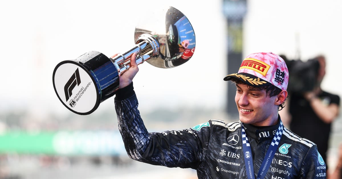 Young race car driver Kimi Antonelli celebrating victory at Japanese Grand Prix podium