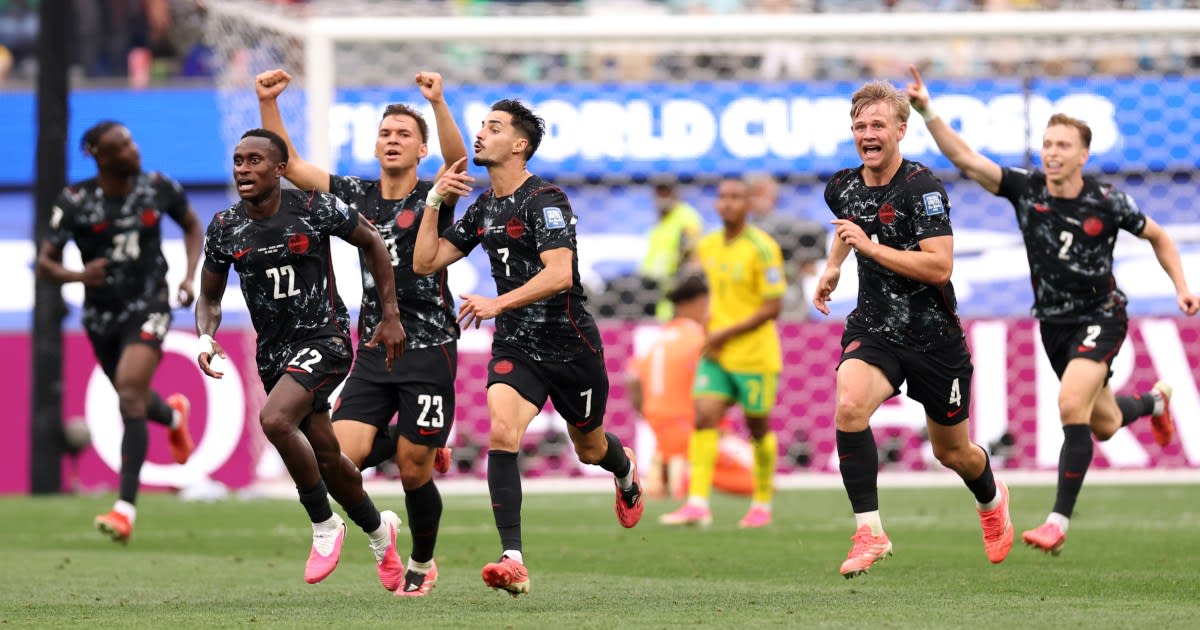 Canadian soccer players celebrating on field after historic World Cup knockout victory