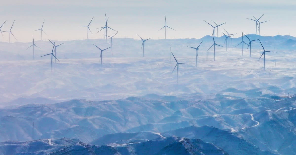 ** Solar panels and wind turbines generating clean renewable electricity in modern China power grid