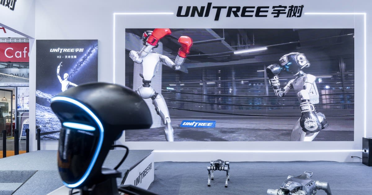 Unitree humanoid robot performing backflip demonstration at technology showcase event