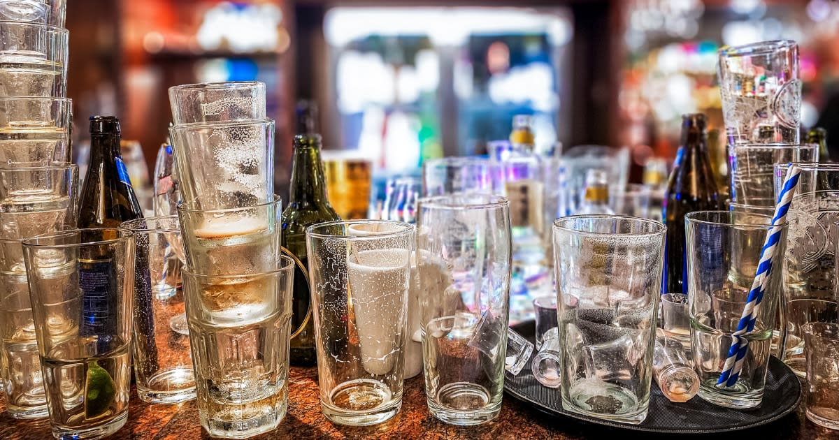 ** Young diverse group of friends socializing together with non-alcoholic beverages at casual gathering