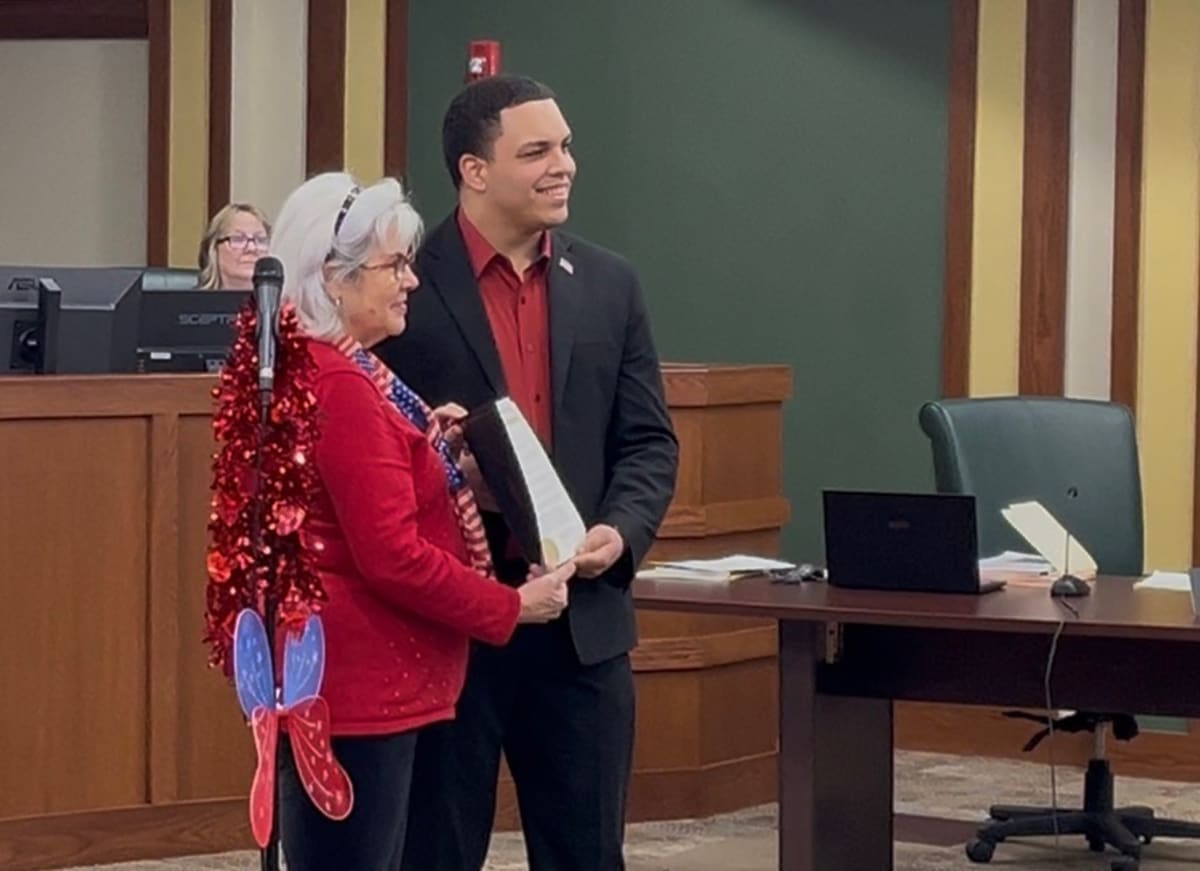 Holly Myers stands with Moorestown Mayor Quinton Law at town hall celebrating Kindness Day proclamation