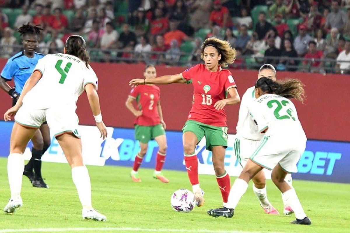 Moroccan women's soccer players celebrate after scoring winning goal against Algeria at home stadium