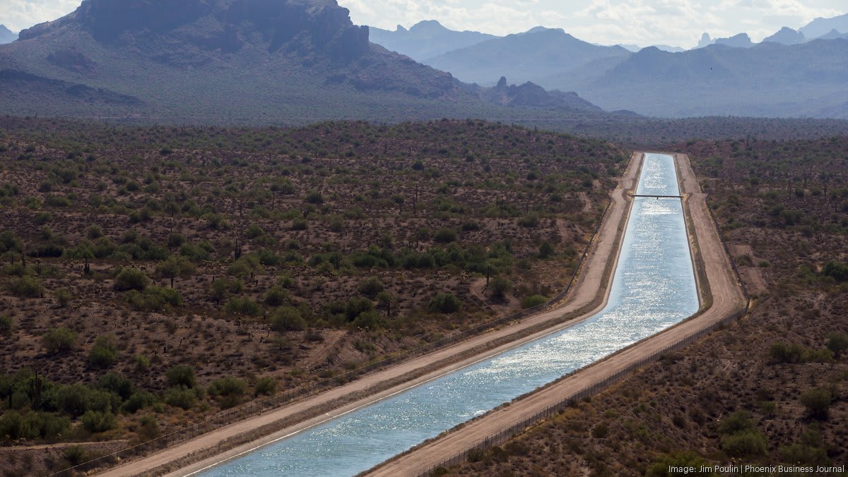 Modern water treatment facility with purification tanks in Arizona desert landscape