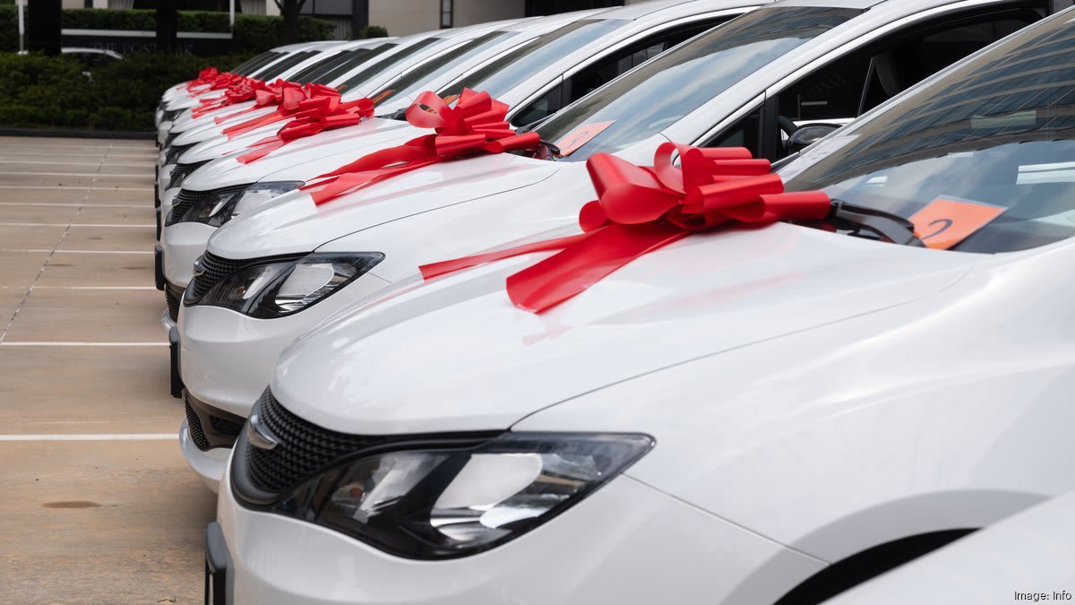 Wheelchair-accessible van with side ramp extended, ready to transport families in need