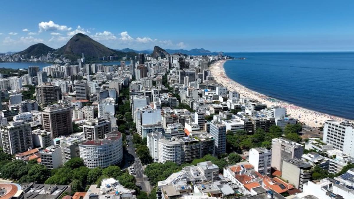 ** Volunteers planting native trees in urban Rio de Janeiro forest restoration project