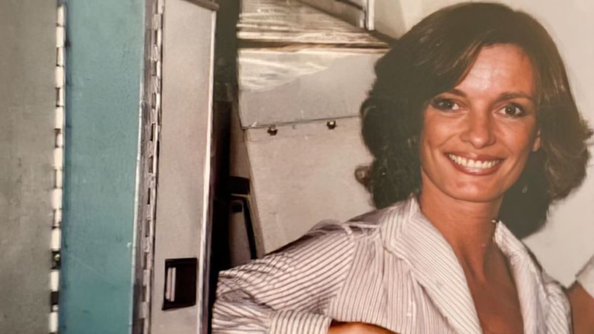 Historic photo of Joan Prince Crandall in vintage flight attendant uniform from 1959