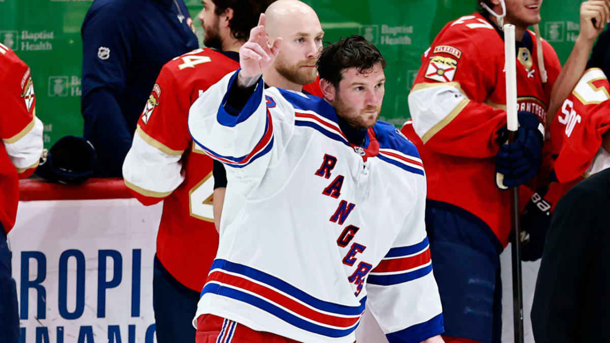 NHL goalie Jonathan Quick in New York Rangers uniform making save during final career game