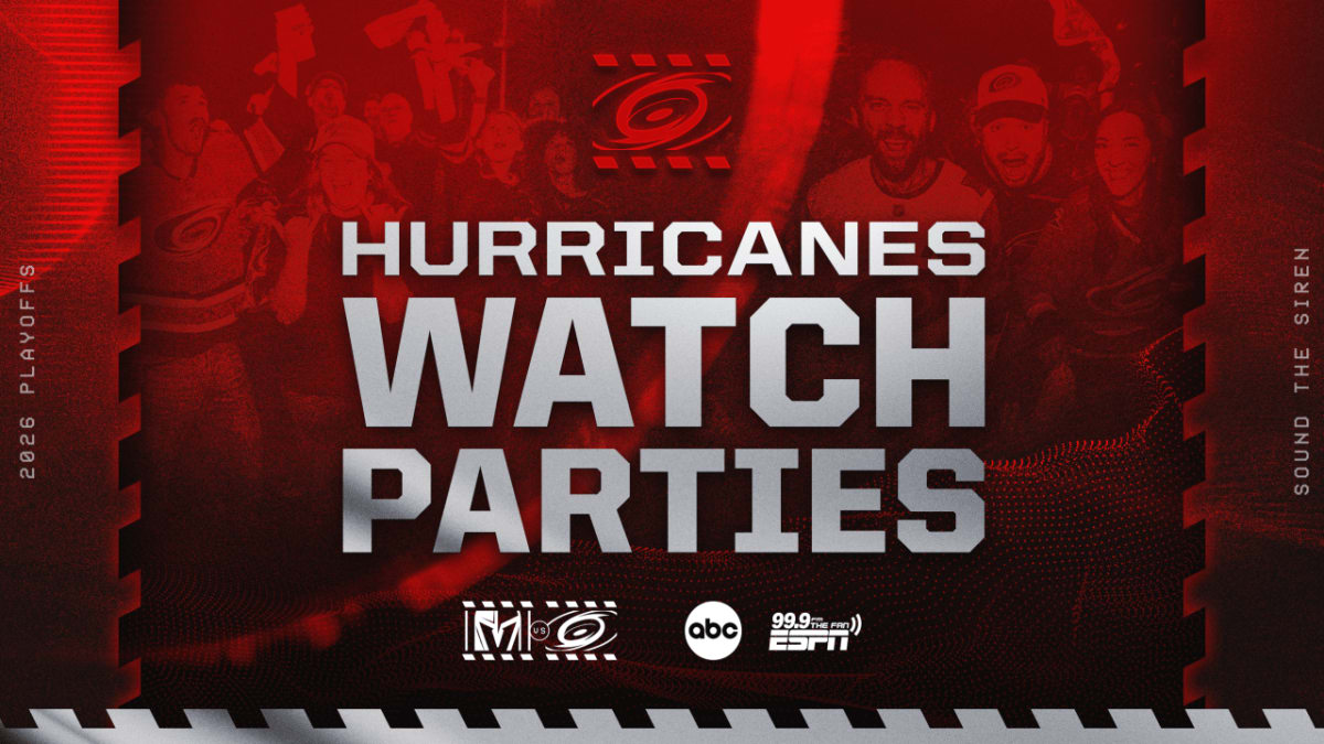 Carolina Hurricanes fans celebrating together inside Lenovo Center arena during Stanley Cup watch party