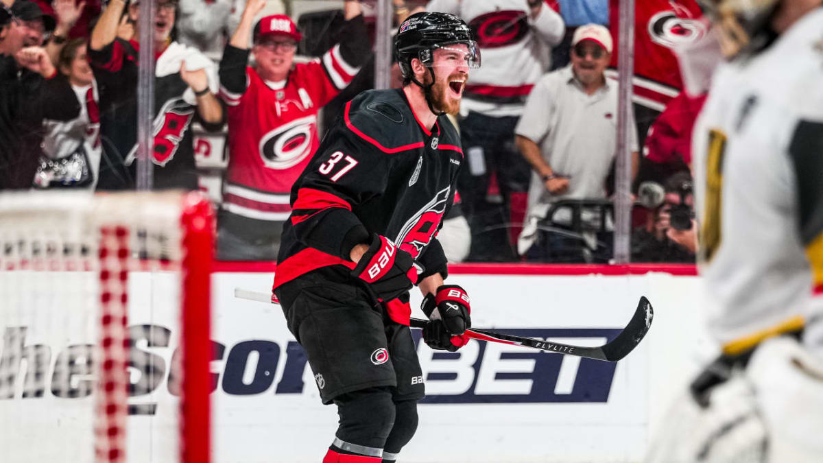 Carolina Hurricanes players celebrating on ice after defeating Vegas Golden Knights in Game 5