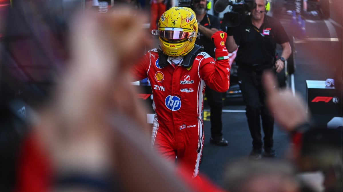 Lewis Hamilton celebrating in Ferrari racing suit after winning Barcelona Grand Prix