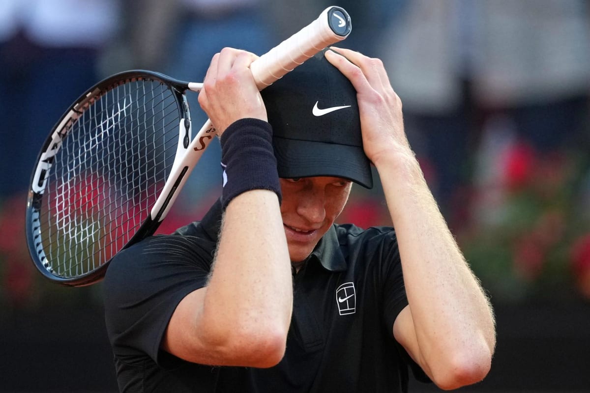 Jannik Sinner celebrates with raised arms after winning Italian Open tennis championship in Rome