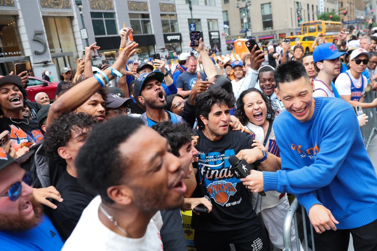Former Knicks player Jeremy Lin interviews excited fans outside Madison Square Garden before NBA Finals game