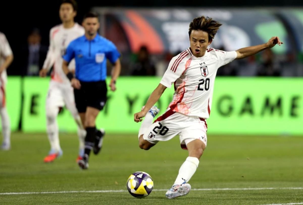 Takefusa Kubo in Japan national team jersey during World Cup squad announcement ceremony