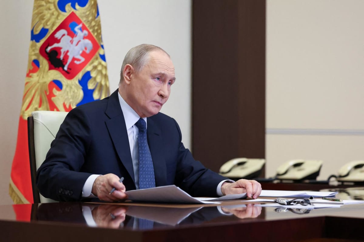 Russian President Vladimir Putin speaking during a video conference meeting at state residence
