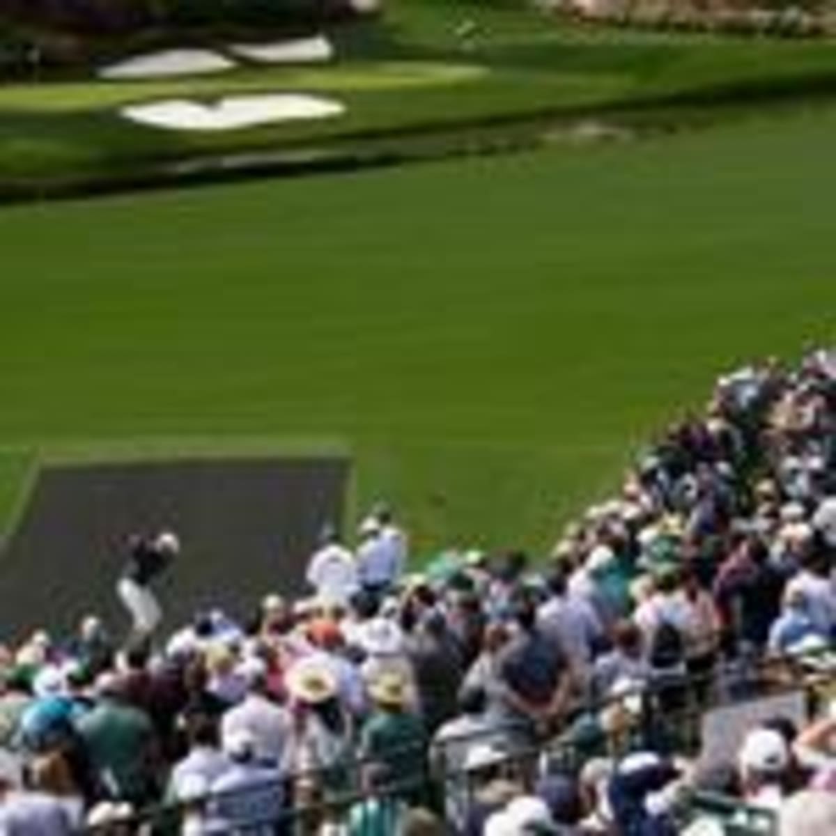 Bernhard Langer in green Masters jacket signing autograph at Augusta National Golf Club