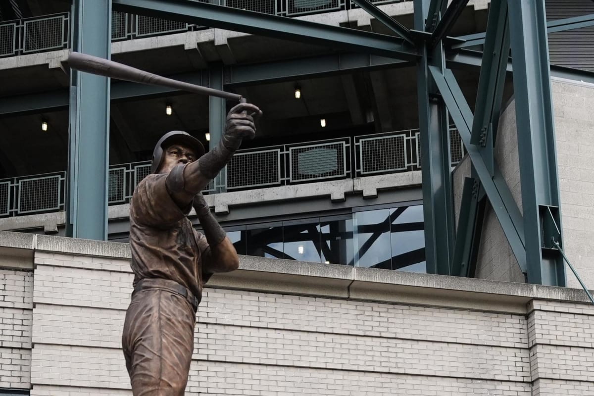 Bronze statue of Ichiro Suzuki in batting stance with broken bat during unveiling ceremony