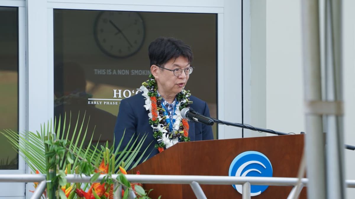 ** Grand opening celebration of Hoʻōla cancer research center with community members and dignitaries in Hawaii