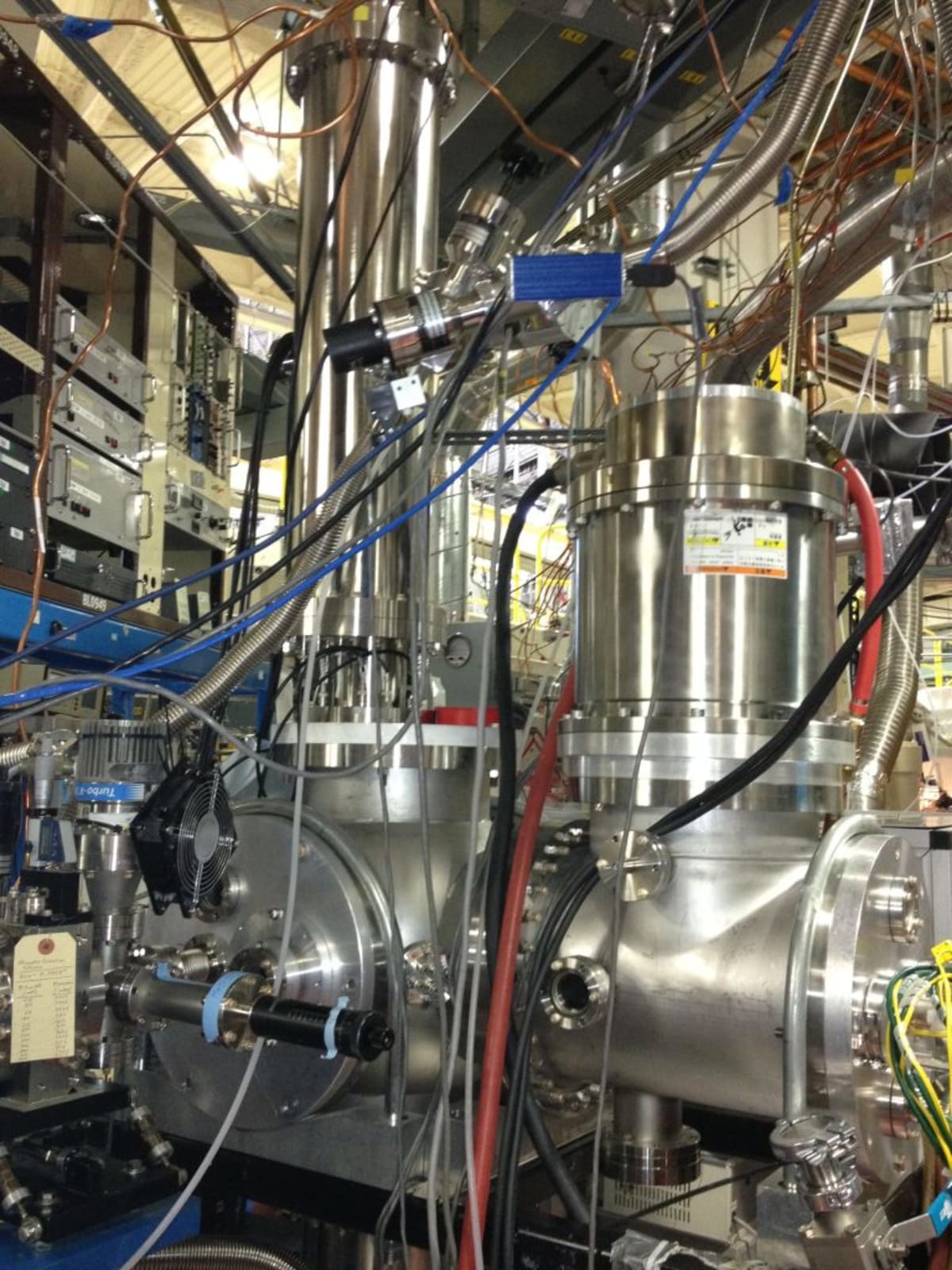 Scientists working with high-power laser equipment in clean energy research laboratory at University of Hawaii