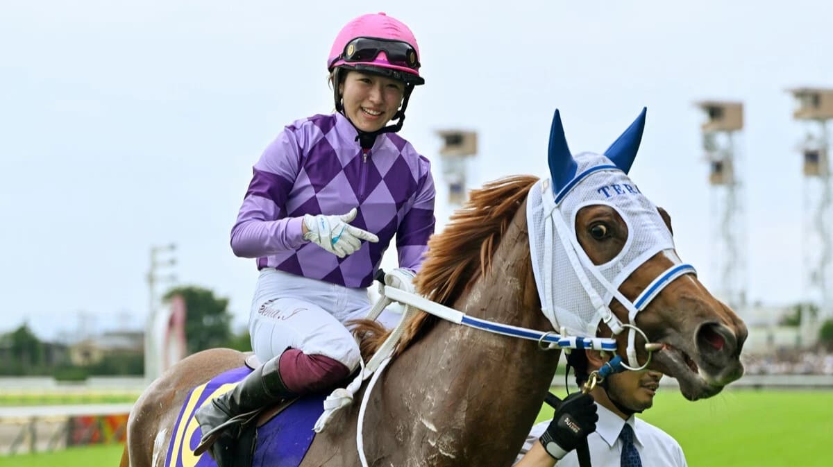 Female jockey Seina Imamura celebrating historic Grade 1 victory at Tokyo Racecourse