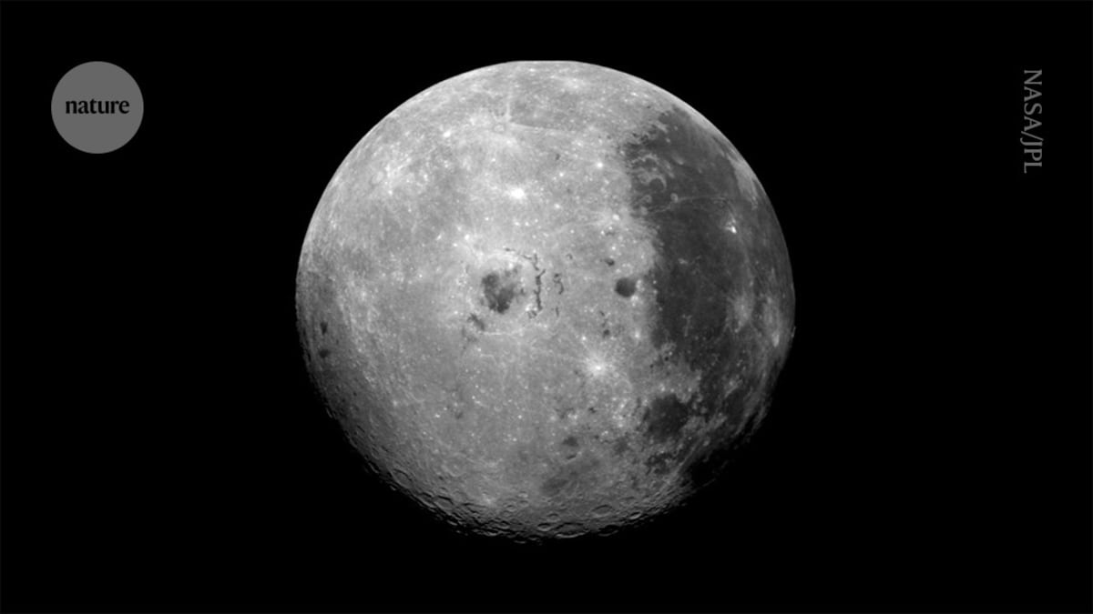 Four Artemis II astronauts in blue flight suits during launch rehearsal at NASA facility
