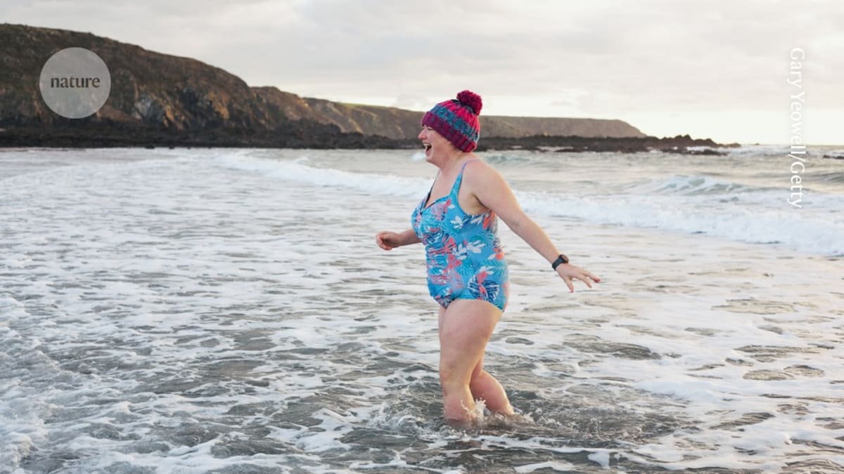 Middle-aged woman jogging outdoors in athletic wear, smiling and healthy in natural sunlight