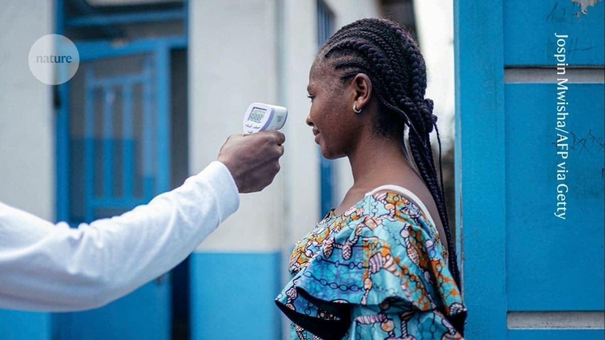 Medical researchers in protective equipment preparing experimental Ebola treatments for clinical trials in Africa