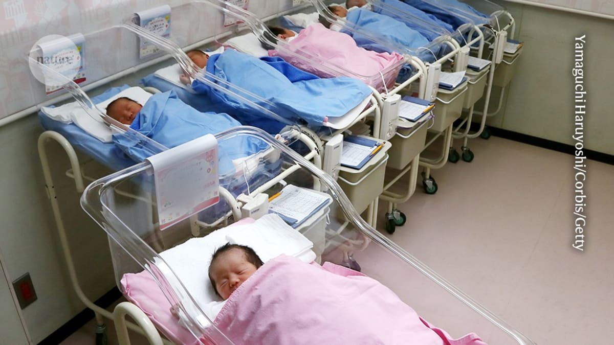 Baby sleeping peacefully on back in crib, demonstrating safe sleep position that prevents SIDS