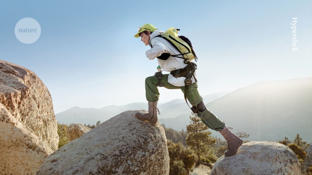 Person wearing lightweight robotic exoskeleton device walking outdoors demonstrating modern assistive mobility technology