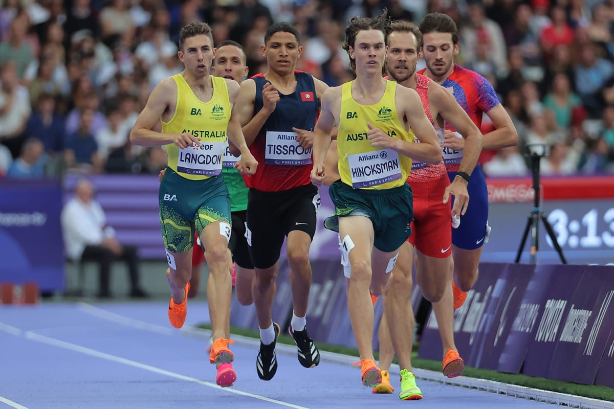 Young Paralympic runner Angus Hincksman celebrating after breaking the T38 1500m world record