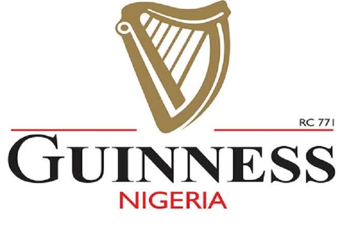 Guinness beer bottles on production line in Nigerian brewery facility