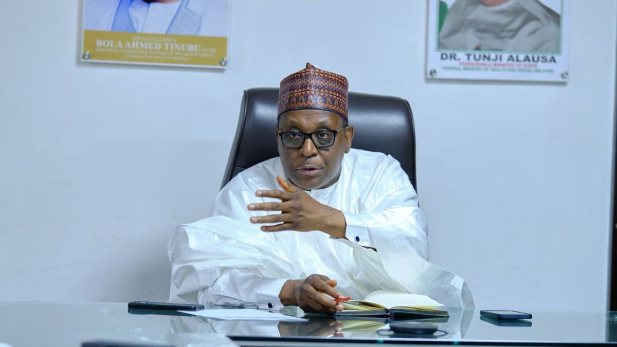 Nigerian healthcare workers reviewing disease surveillance data at modern health facility
