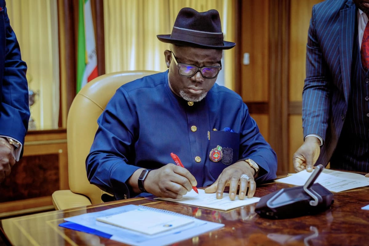 Nigerian medical professionals in white coats working in a Delta State hospital facility
