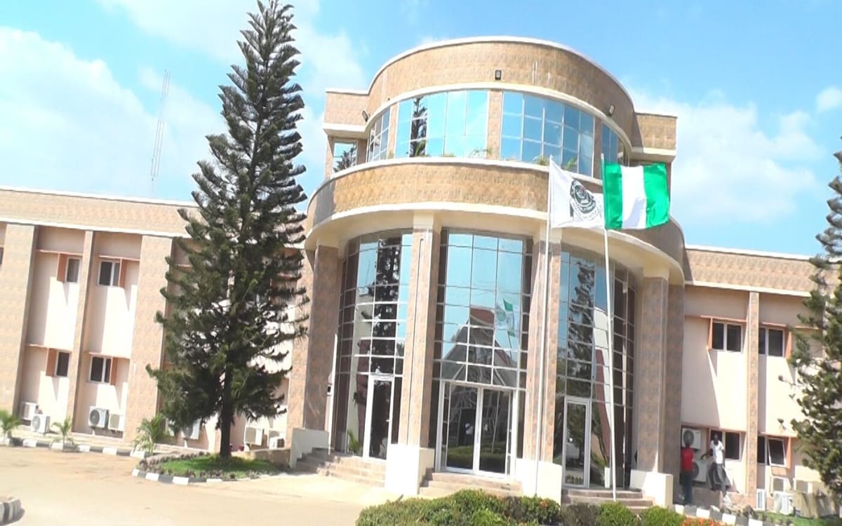 Nigerian students completing university registration forms at official JAMB education center