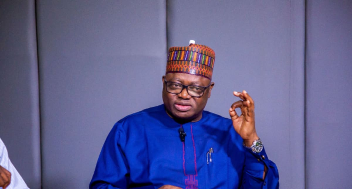 Nigerian youth gathering in community meeting learning about new alcohol safety regulations